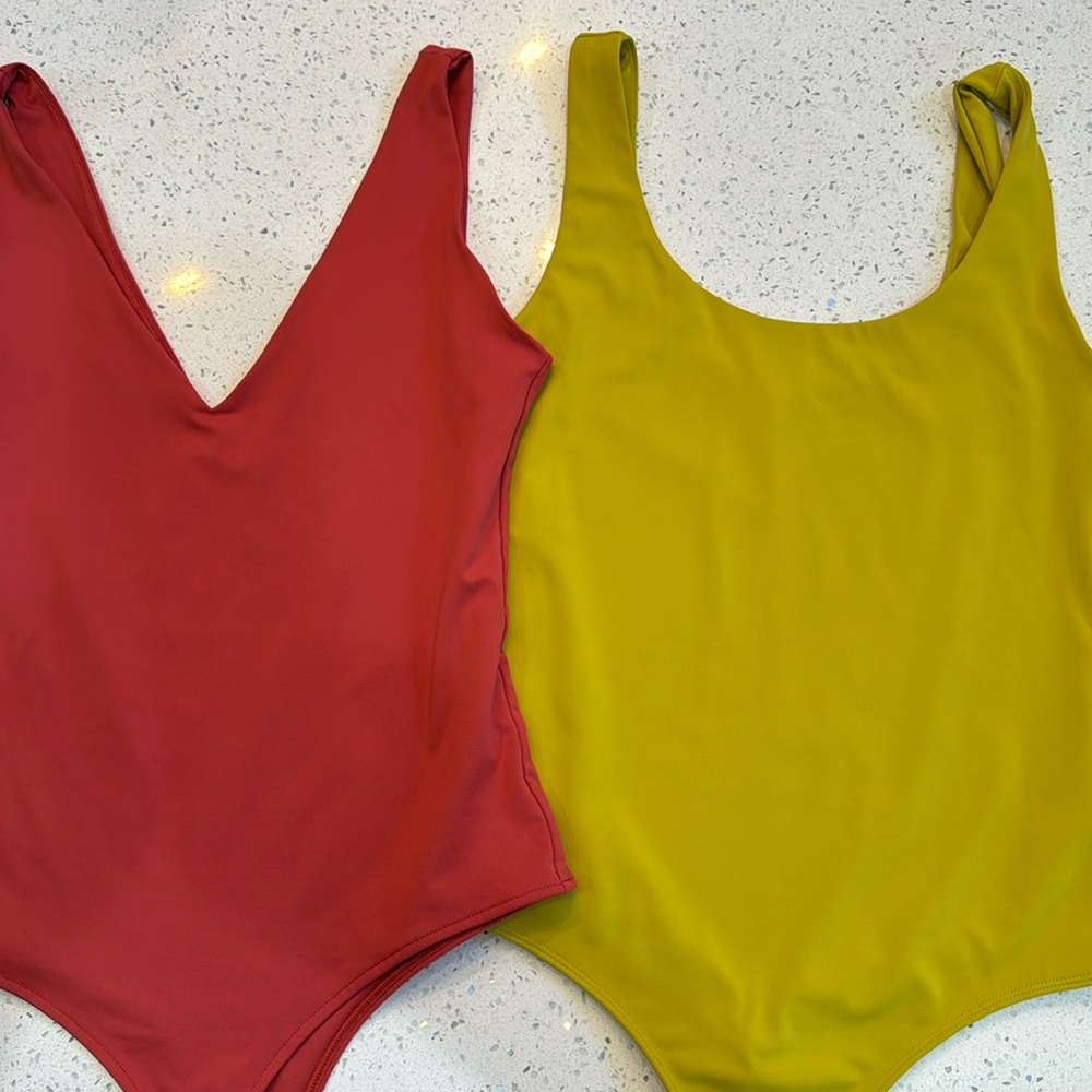 Two lined bodysuits L M express